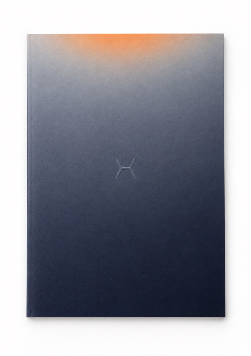 ALPYNEX’s orange-to-midnight palette on its debossed book cover